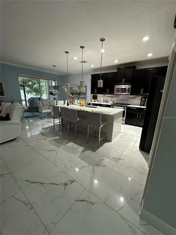 a kitchen with stainless steel appliances lots of counter top space