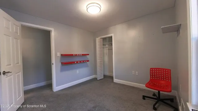 a room with furniture and a window