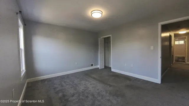 an empty room with a bathroom