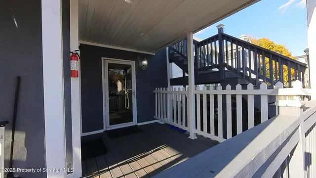 a view of balcony with wooden floor