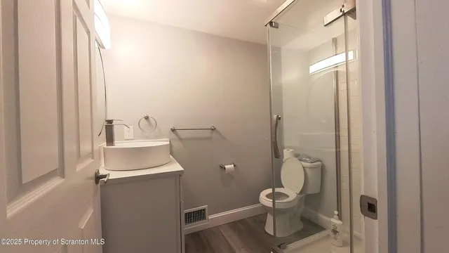 a bathroom with a toilet and a sink