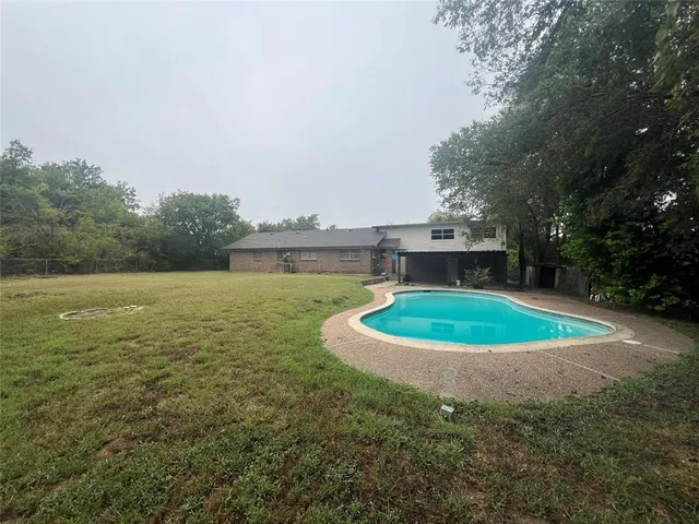 a view of a lake with a building in the background