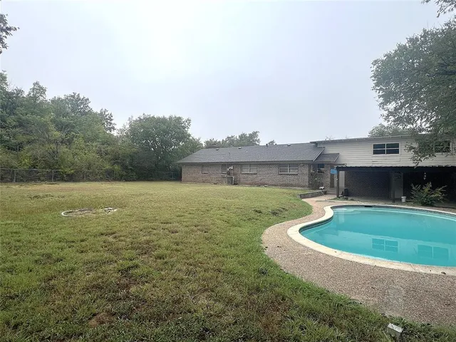 a view of outdoor space yard and swimming pool