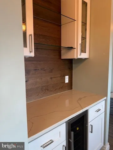 a kitchen with a white cabinets and a stove