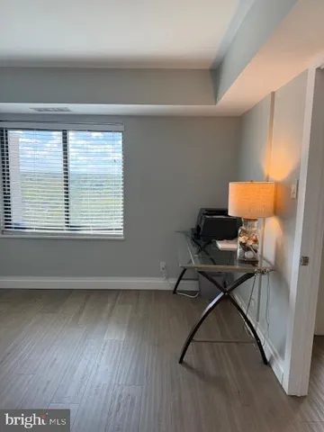 a workspace with furniture and a window