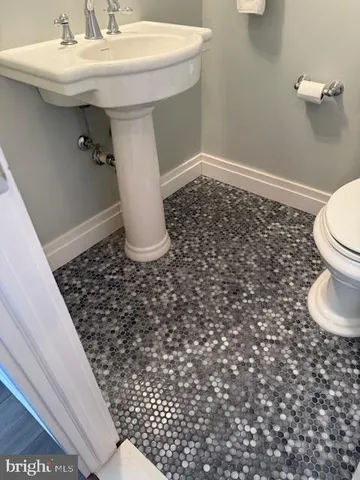a bathroom with a sink and a toilet