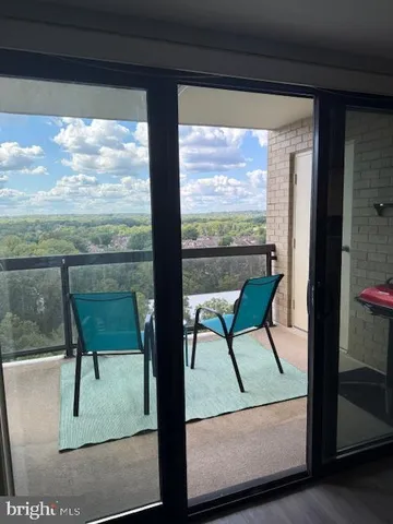 a view of a room with a furniture from a window