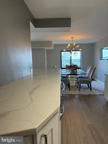 a workspace with furniture and chandelier