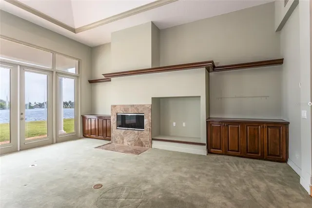 a view of a livingroom with furniture and staircase