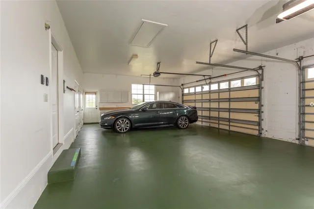 a view of a livingroom with furniture and a garage