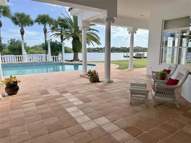 a view of swimming pool with outdoor seating