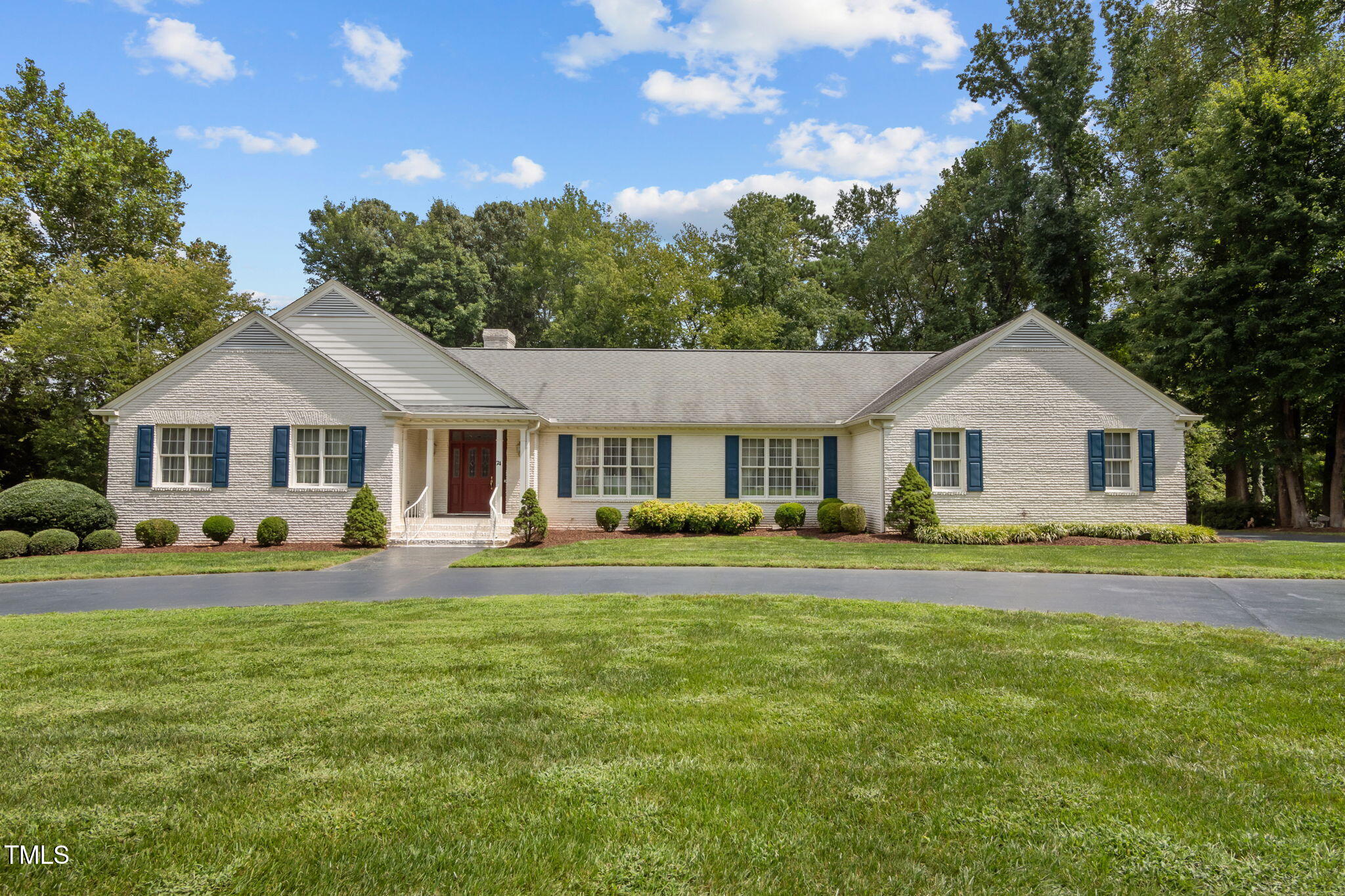 74 Alleghany Drive Roxboro, NC 27573 - Photo 1 of 62 a front view of a house with a yard table and chairs