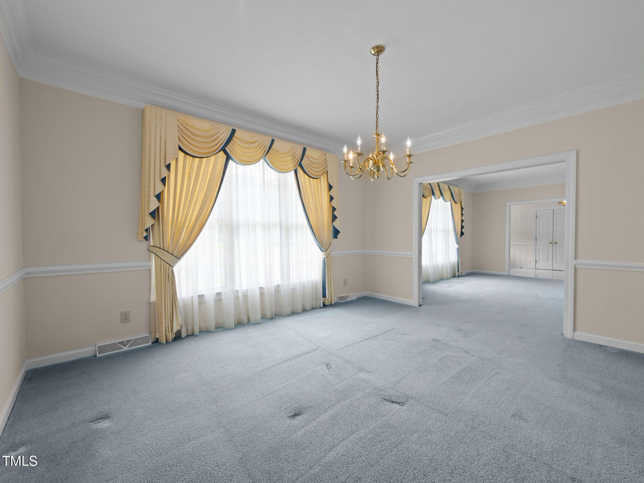 74 Alleghany Drive Roxboro, NC 27573 - Photo 12 of 62 a view of a room with windows and chandelier