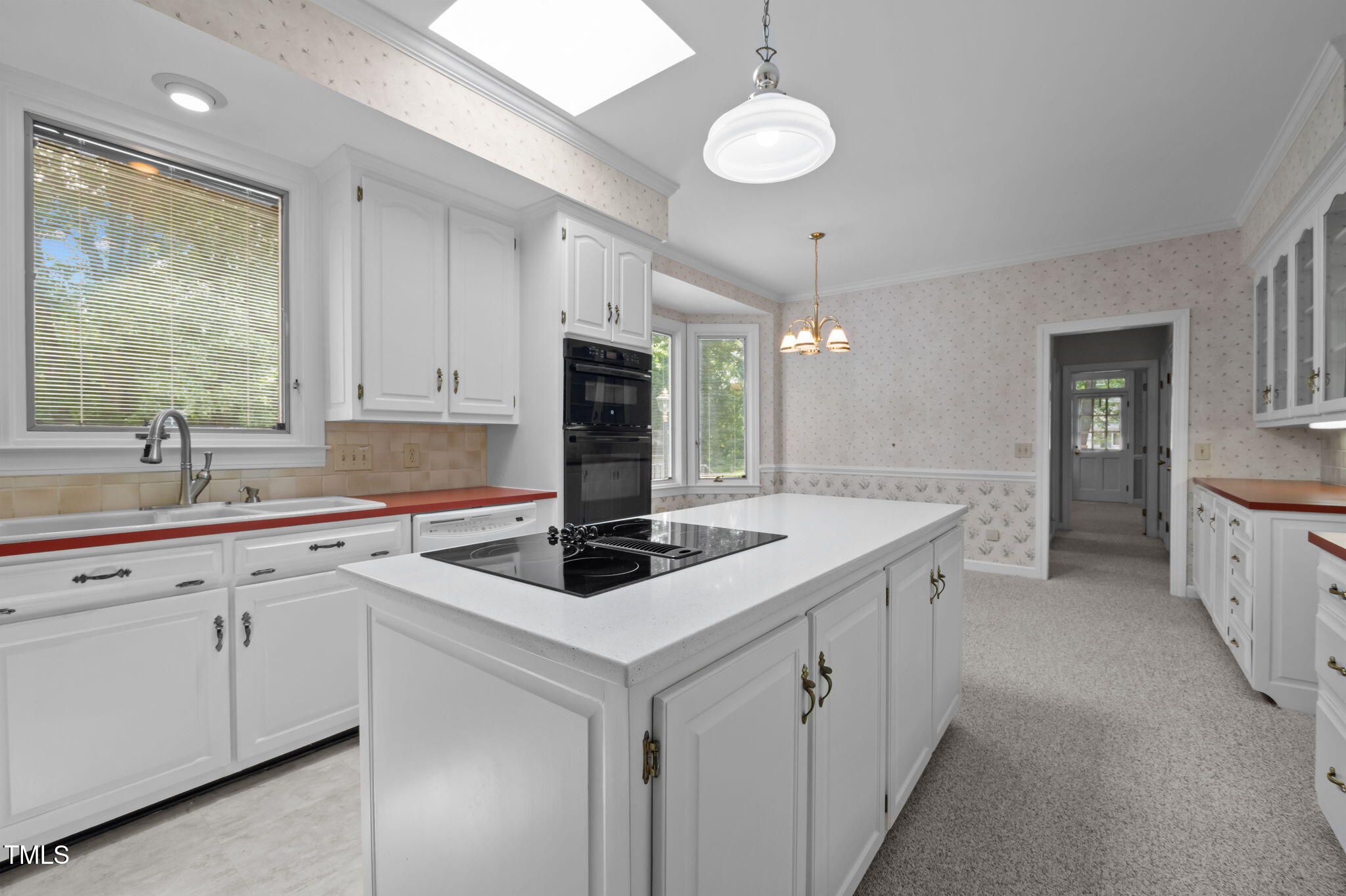 74 Alleghany Drive Roxboro, NC 27573 - Photo 13 of 62 a kitchen that has a sink and a stove in it