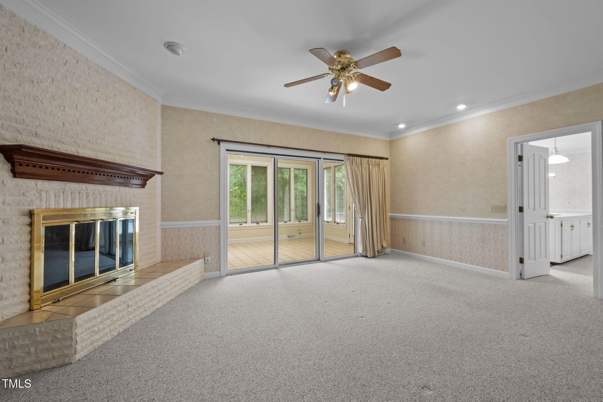 74 Alleghany Drive Roxboro, NC 27573 - Photo 19 of 62 a view of an empty room with a fireplace