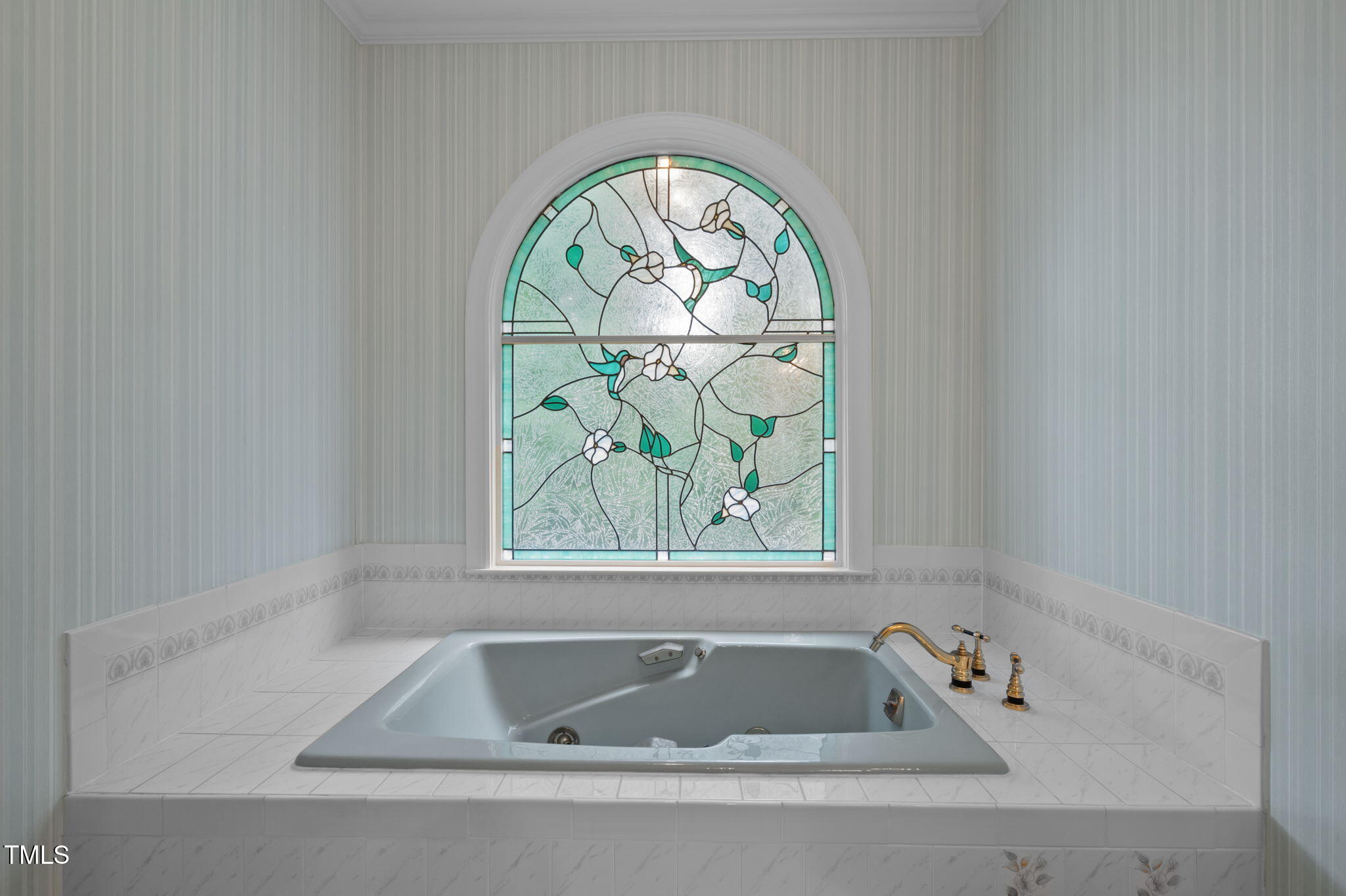 74 Alleghany Drive Roxboro, NC 27573 - Photo 25 of 62 a bathroom with a tub and window