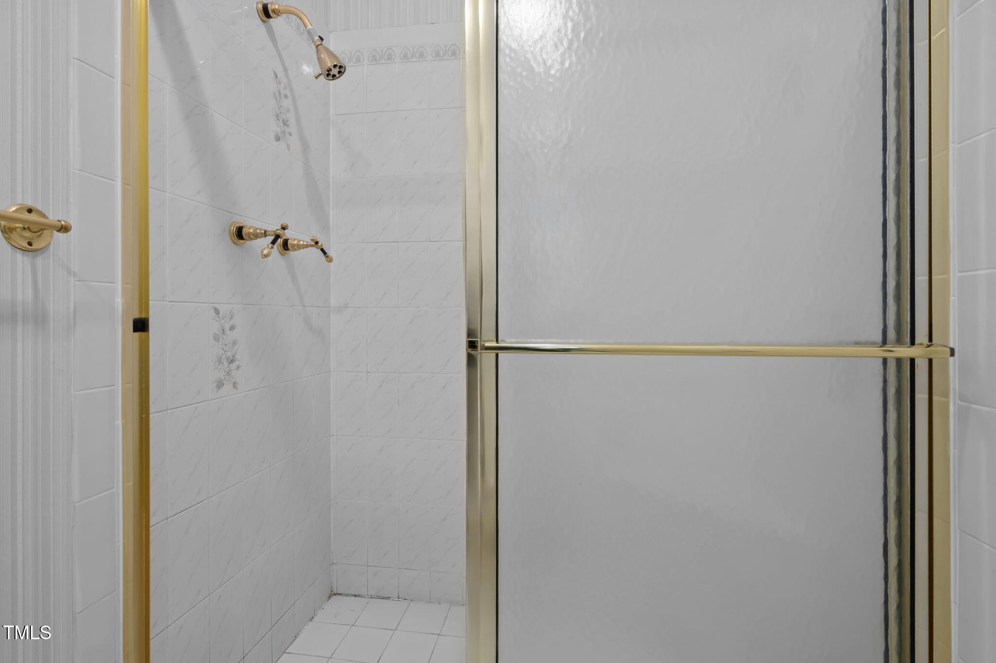 74 Alleghany Drive Roxboro, NC 27573 - Photo 27 of 62 a bathroom with a glass shower door