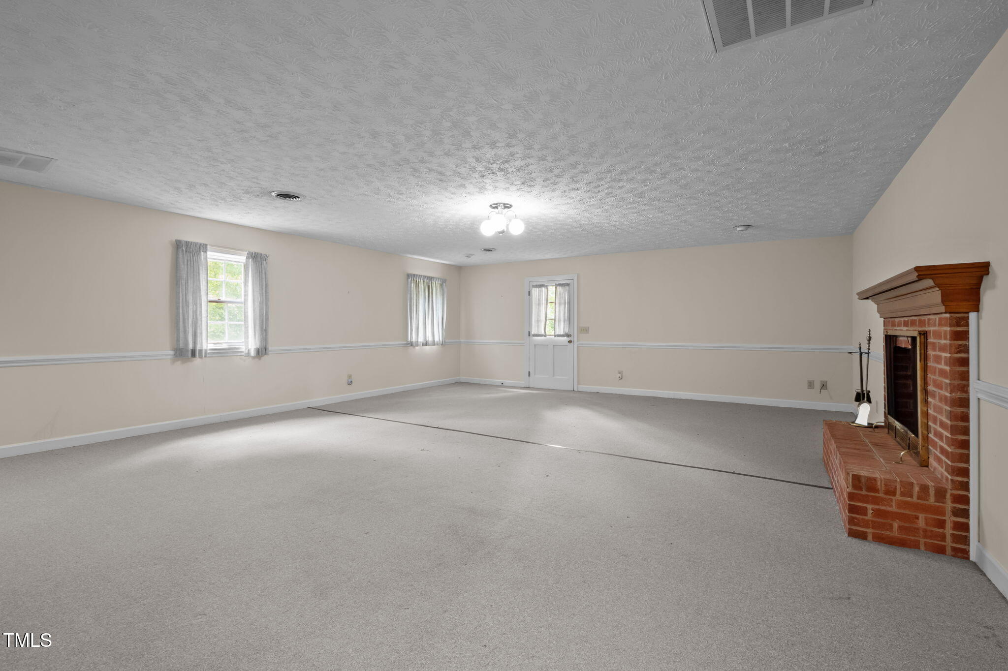 74 Alleghany Drive Roxboro, NC 27573 - Photo 38 of 62 an empty room with windows