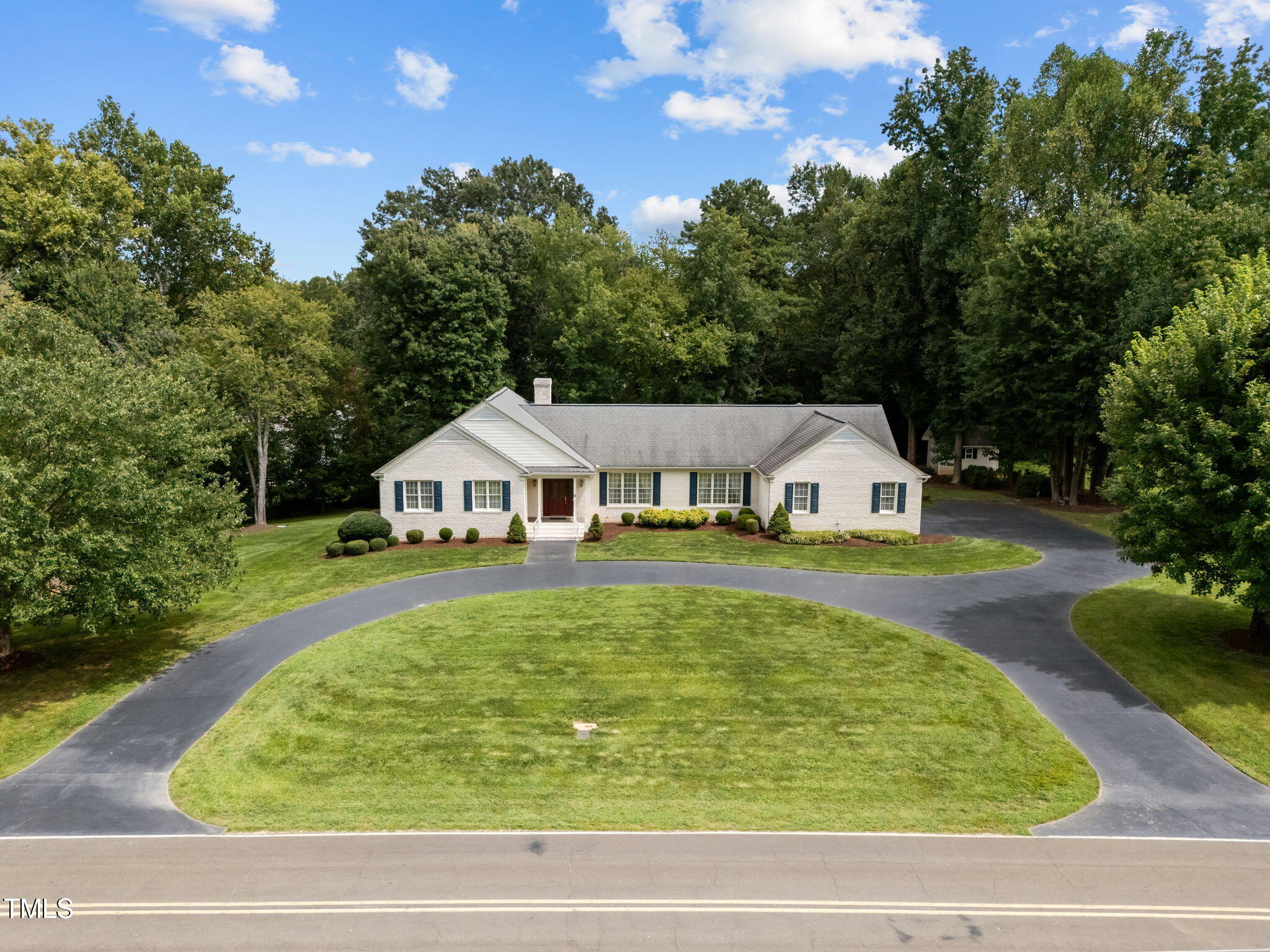 74 Alleghany Drive Roxboro, NC 27573 - Photo 4 of 62 a view of swimming pool with seating space and trees in the background