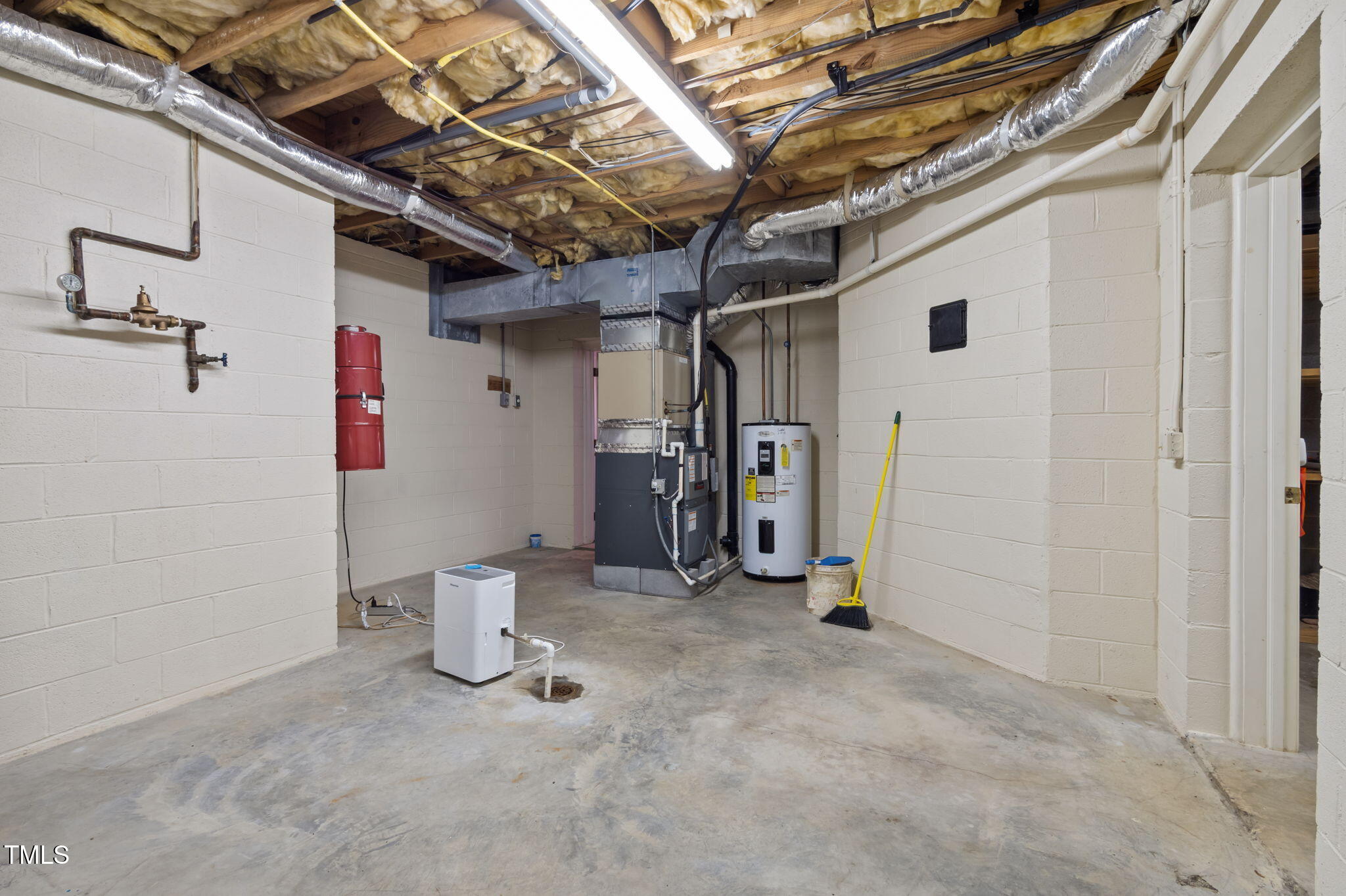 74 Alleghany Drive Roxboro, NC 27573 - Photo 42 of 62 a view of storage and utility room