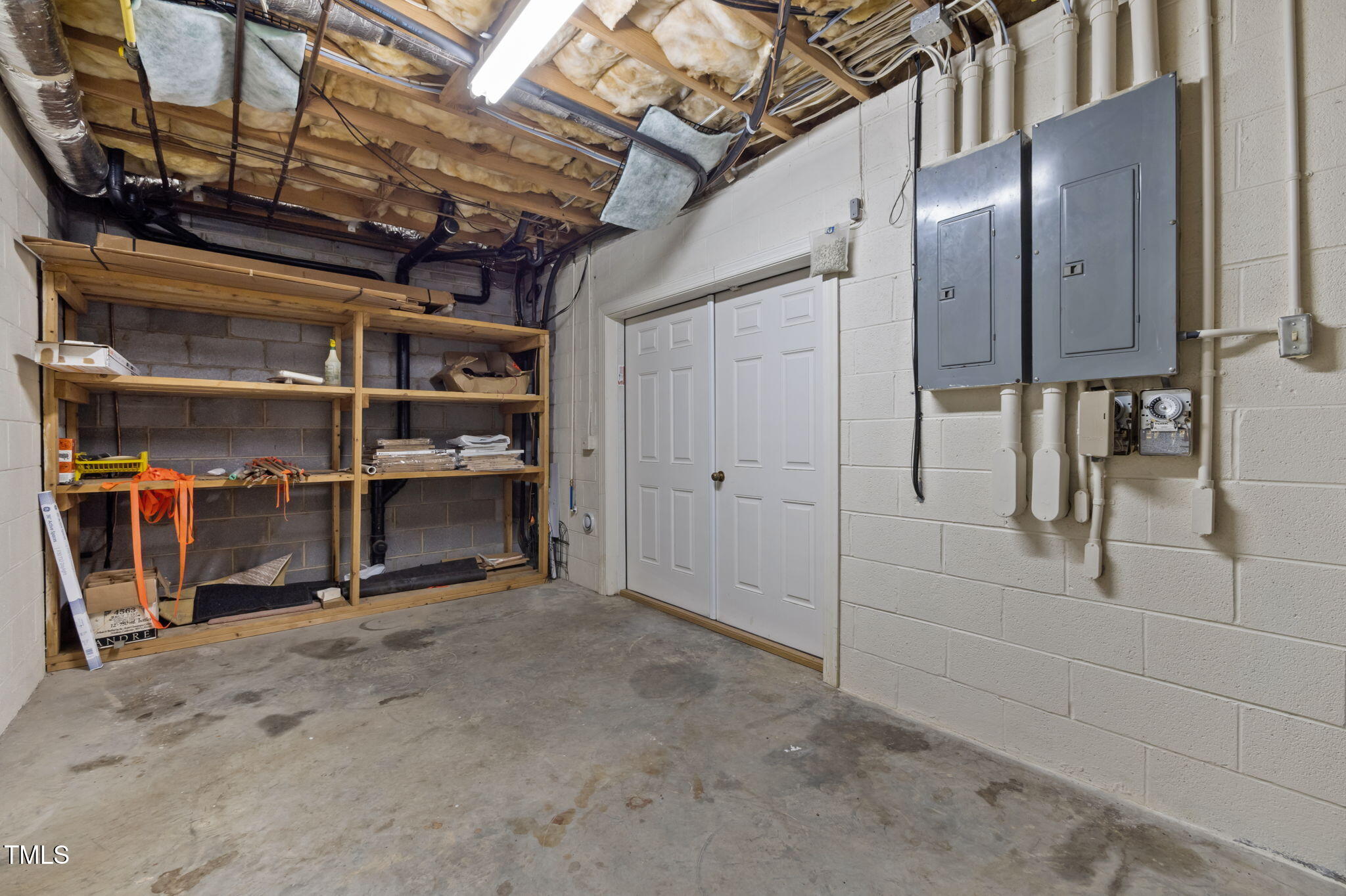74 Alleghany Drive Roxboro, NC 27573 - Photo 43 of 62 a view of an empty room with racks on the wall