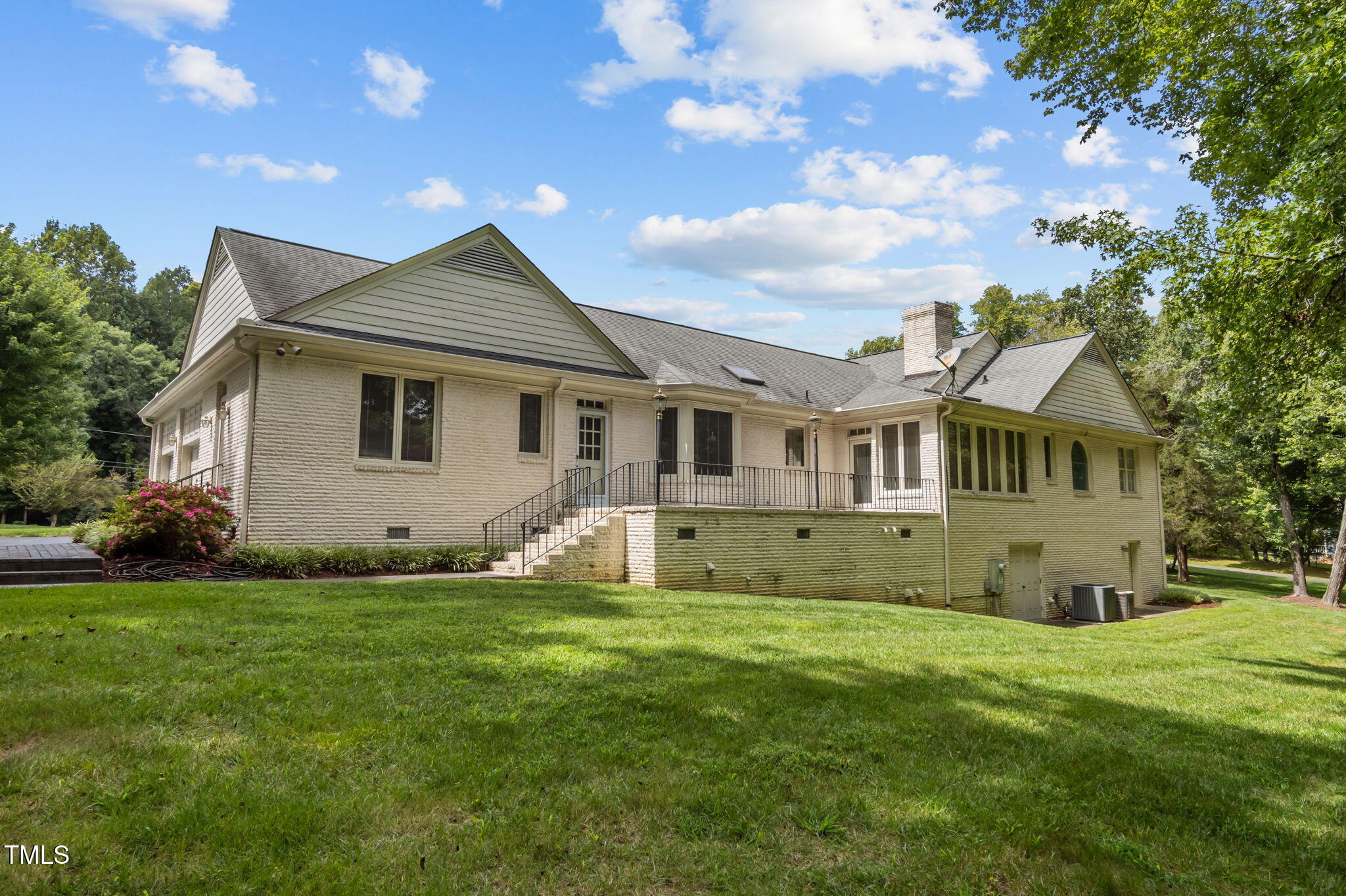 74 Alleghany Drive Roxboro, NC 27573 - Photo 46 of 62 a front view of a house with a garden