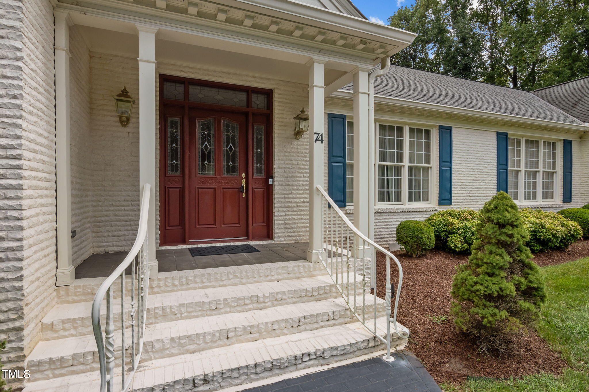 74 Alleghany Drive Roxboro, NC 27573 - Photo 5 of 62 a front view of a house with a garden