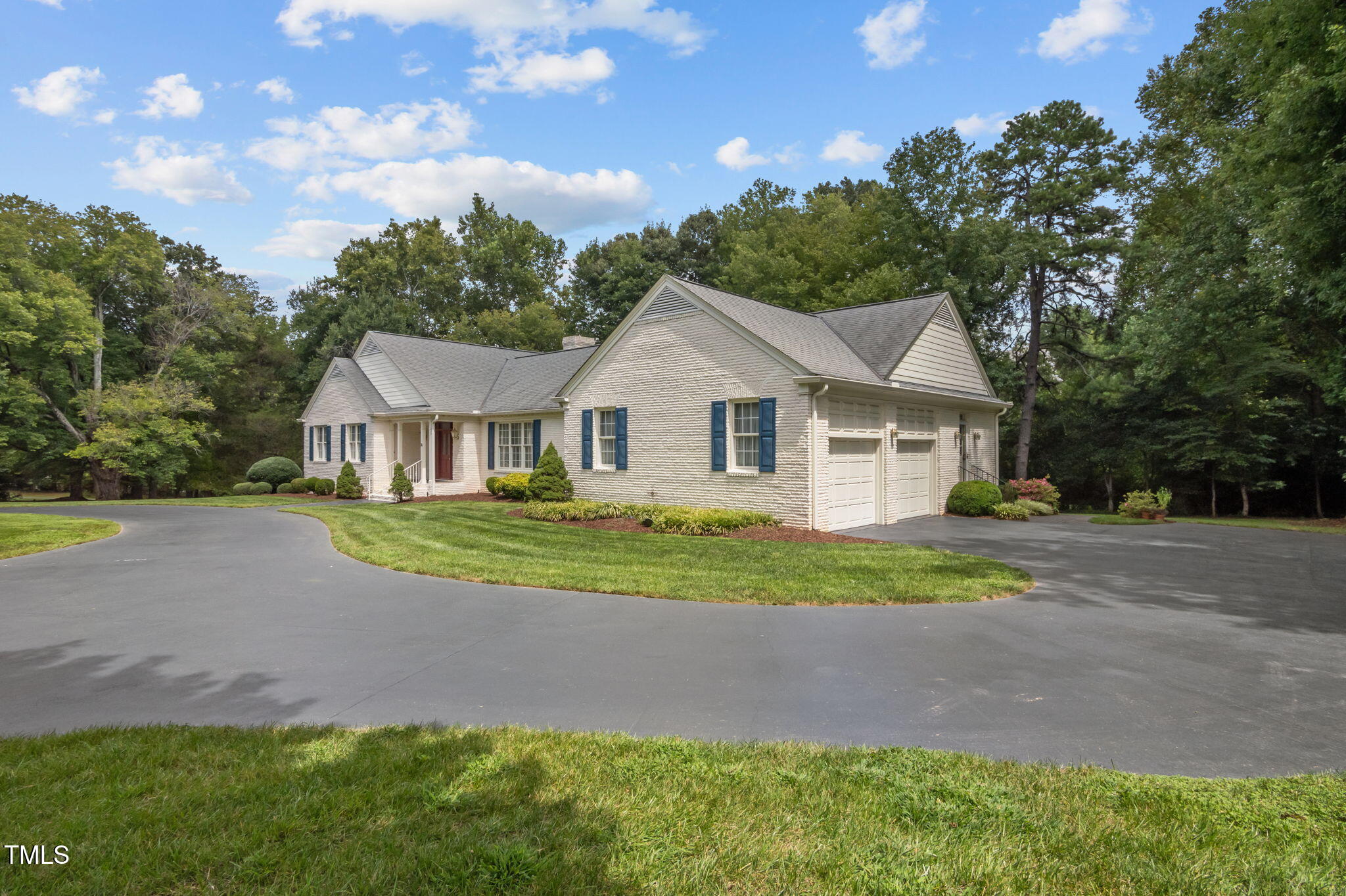 74 Alleghany Drive Roxboro, NC 27573 - Photo 51 of 62 a front view of a house with a yard and garage