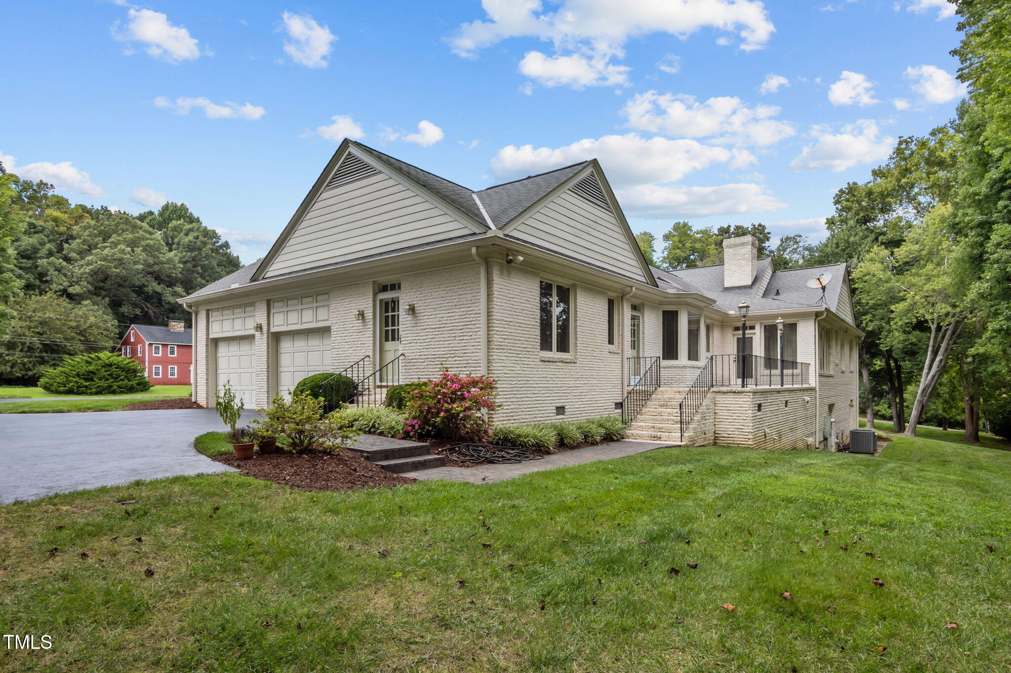 74 Alleghany Drive Roxboro, NC 27573 - Photo 52 of 62 a front view of a house with garden