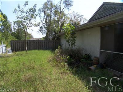 7529 Pebble Beach Road Fort Myers, FL 33967 - Photo 9 of 10 a backyard of a house with lots of green space
