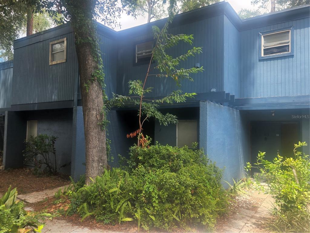 603 Southwest 75th Street, Unit 102 Gainesville, FL 32607 - Photo 1 of 1 a front view of a house