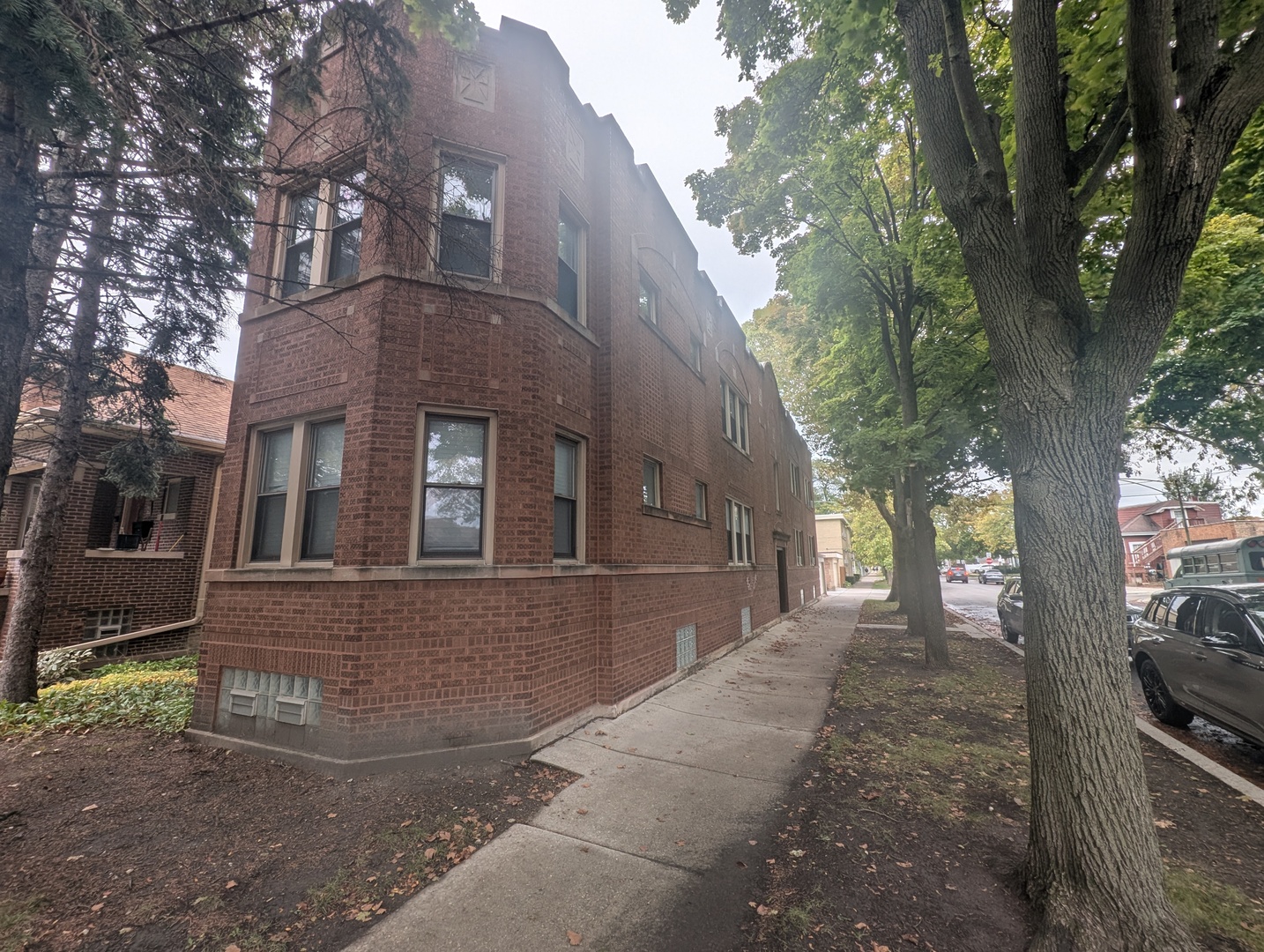 5820 West Berteau Avenue, Unit 2 Chicago, IL 60634 - Photo 1 of 12 a front view of a house with yard and tree