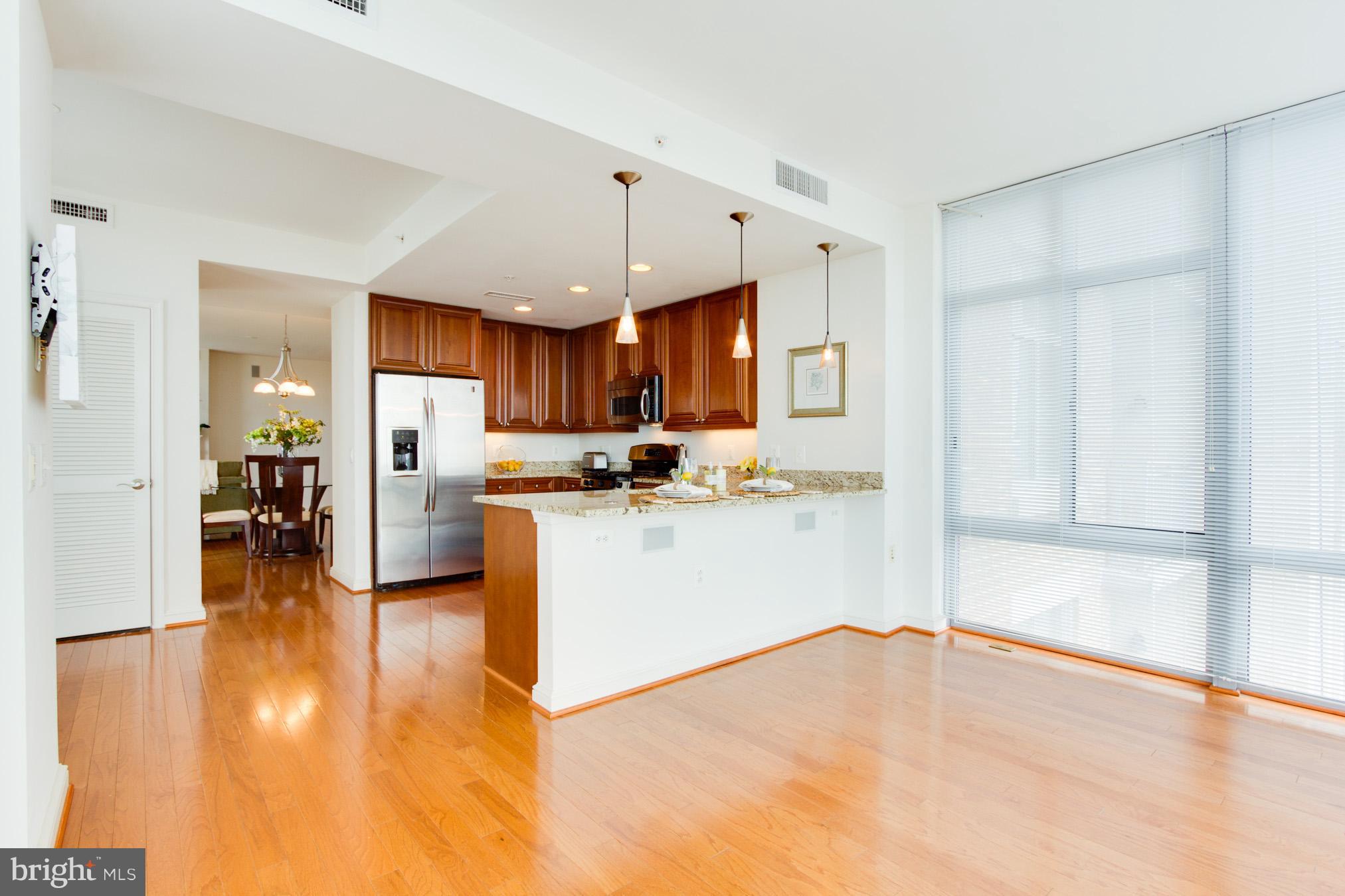 11990 Market Street, Unit 917 Reston, VA 20190 - Photo 15 of 39 Sunroom to Kitchen