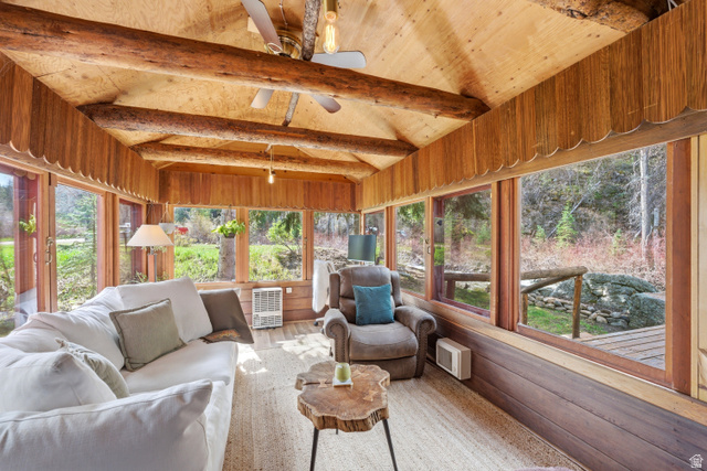 6631 Pine Springs Road Kamas, UT 84036 - Photo 3 of 48 Sunroom with wood-type flooring and lofted ceiling with beams