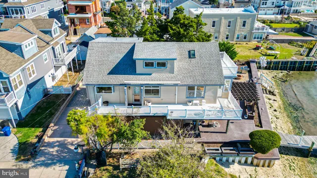 an aerial view of a house with a lake view