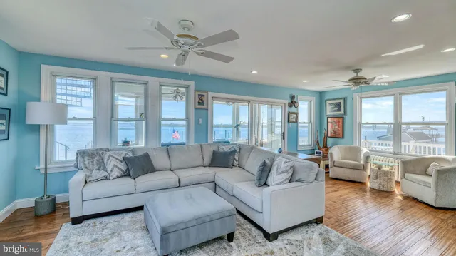 a view of a livingroom with furniture window and wooden floor
