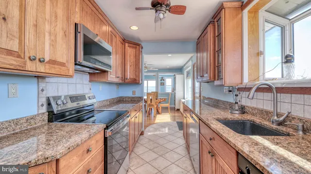 a view of a balcony with wooden fence