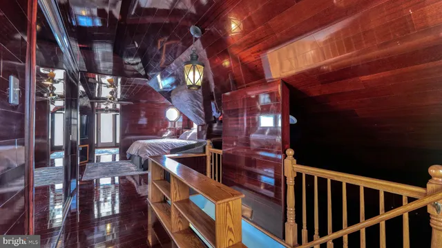 a view of a balcony with wooden floor and city view