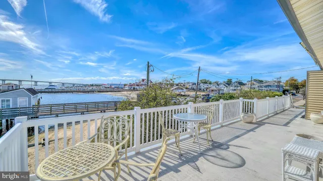 a view of a backyard with sitting area