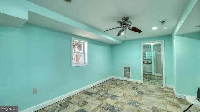 a view of a lake with a table and chairs
