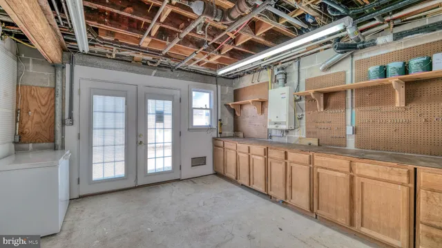 a view of a balcony with wooden floor and outdoor seating