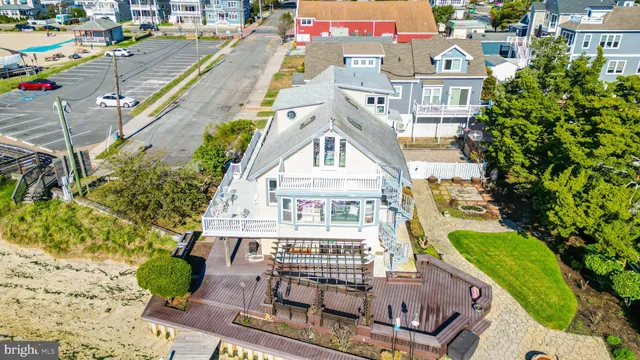 an aerial view of a house with a ocean view