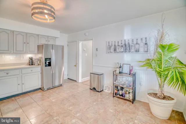 a kitchen with stainless steel appliances a refrigerator and a stove