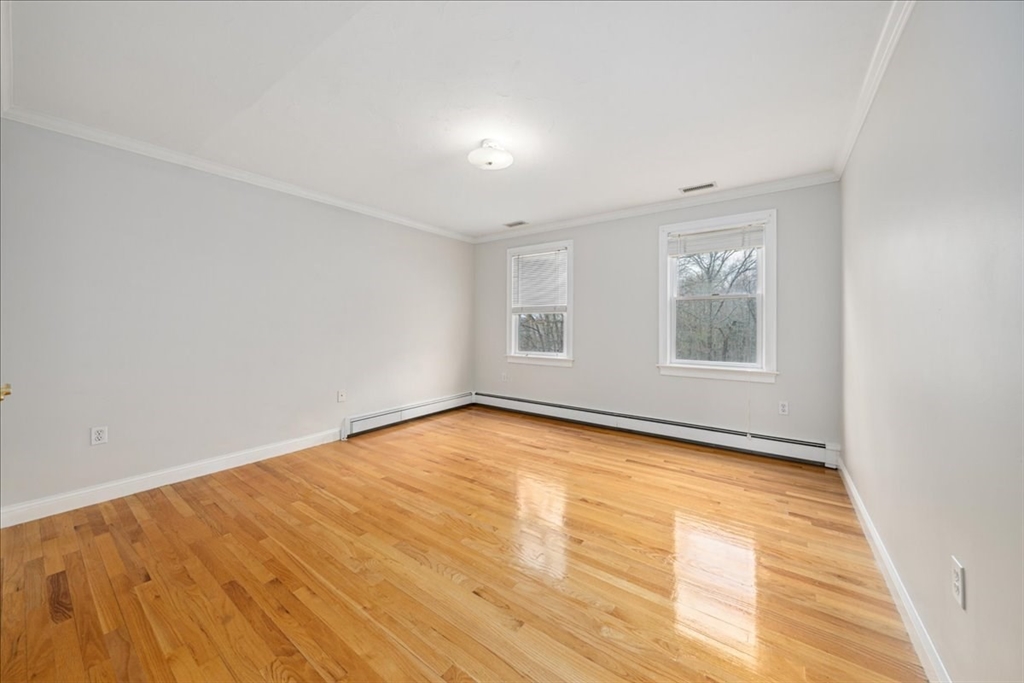 1 Glenbrook Road Framingham, MA 01701 - Photo 11 of 16 an empty room with wooden floor and windows