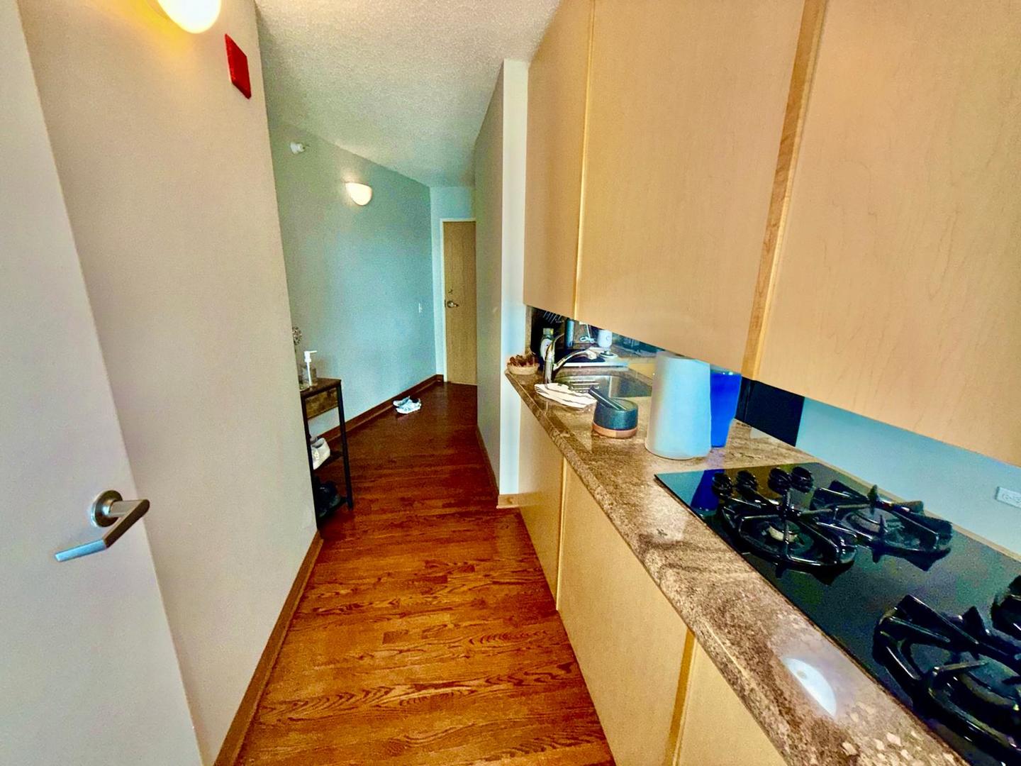 1720 Maple Avenue, Unit 780 Evanston, IL 60201 - Photo 4 of 57 a kitchen with sink stove and cabinets