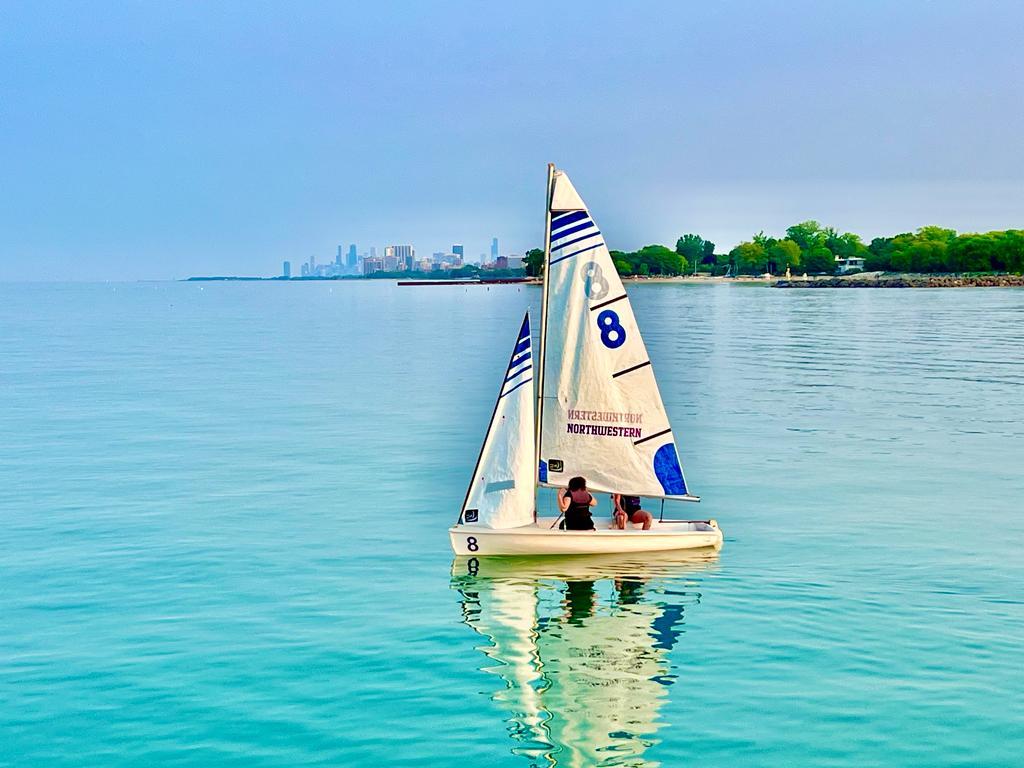 1720 Maple Avenue, Unit 780 Evanston, IL 60201 - Photo 50 of 57 a view of a lake with a bench and boat