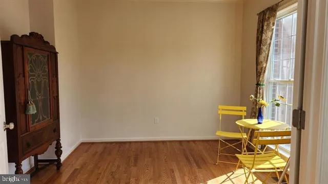 a view of a workspace with wooden floor