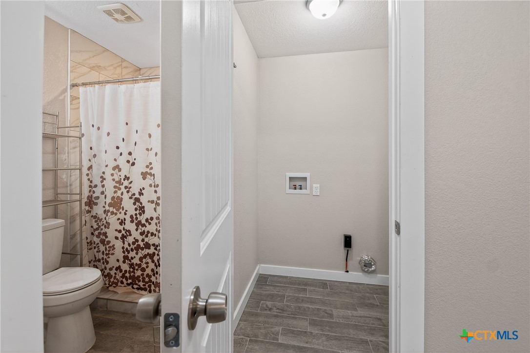 617 Bartlett Road Victoria, TX 77905 - Photo 12 of 30 a bathroom with a toilet and a shower