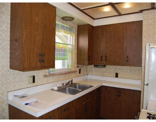 262 Emerson Road Pittsburgh, PA 15209 - Photo 5 of 13 Kitchen. The lighting above stretches across the entire ceiling of the kitchen.
