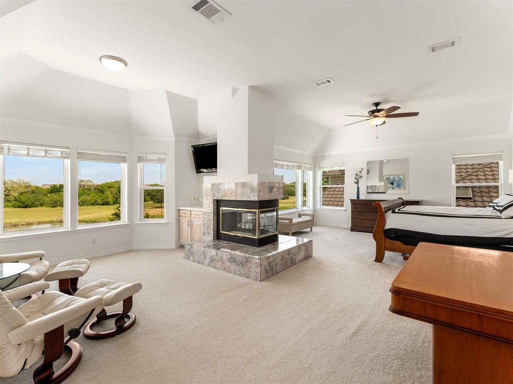 7436 Stoney Point Drive Plano, TX 75025 - Photo 19 of 40 a living room with furniture and fireplace
